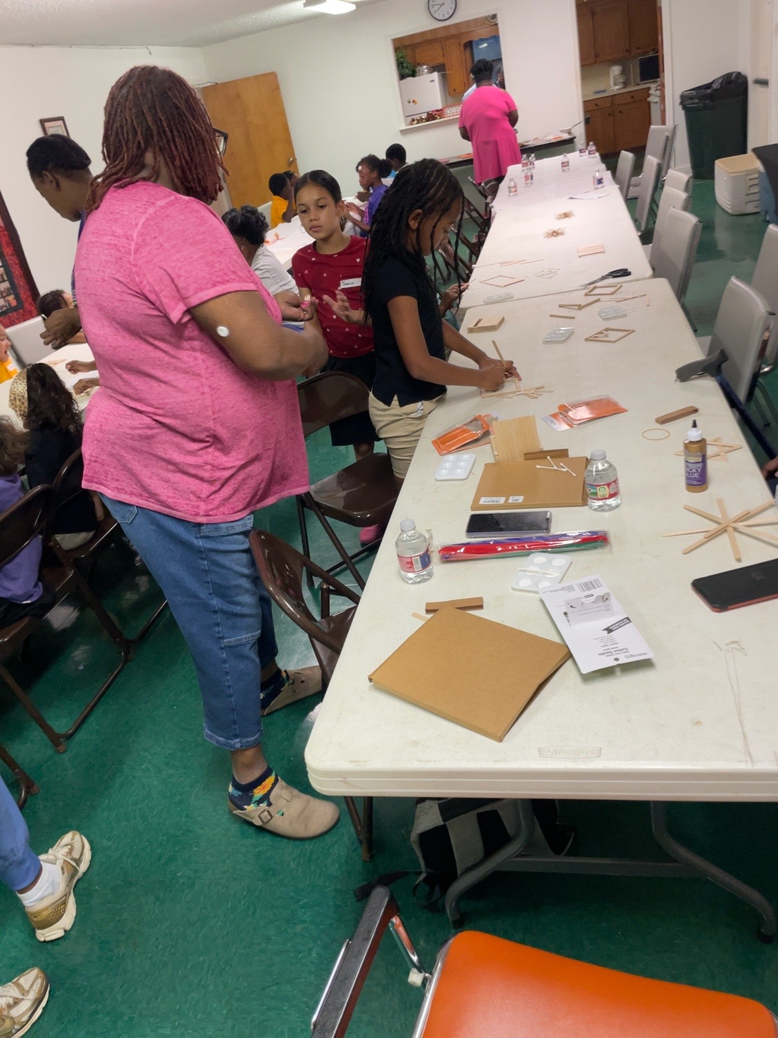 Y.E.P. youth and adult helpers working together during the arts and crafts activity